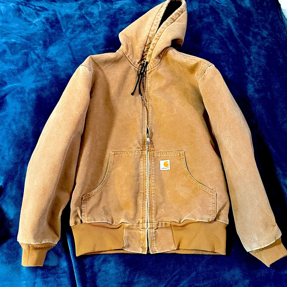 Carhartt jacket size medium. Montana ranched.